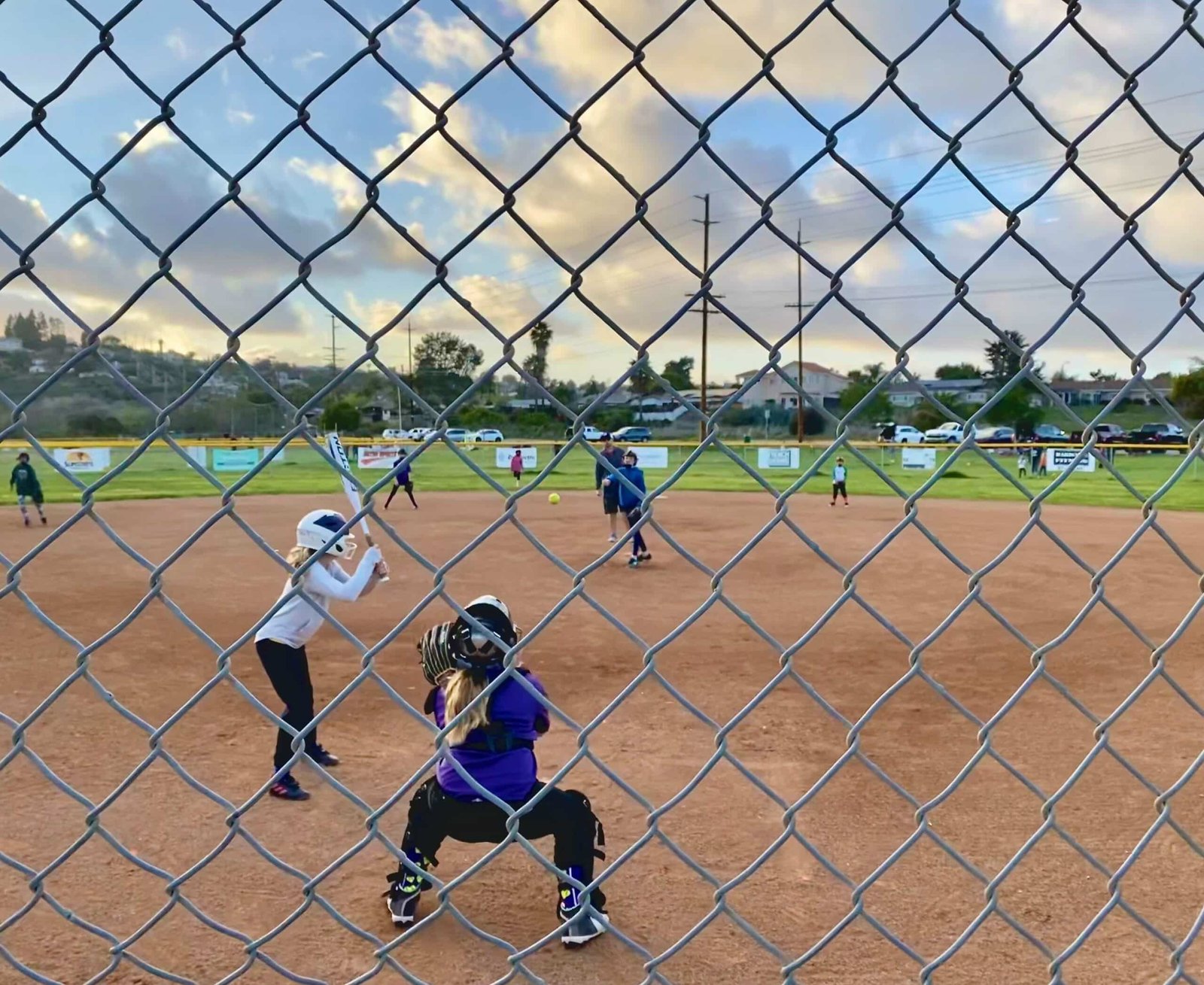 Softball Game being played by girls team Reduced