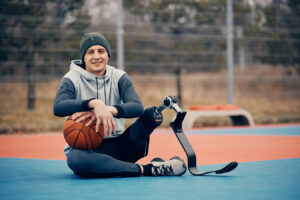 Young Disabled Man Resting After Playing Basketball